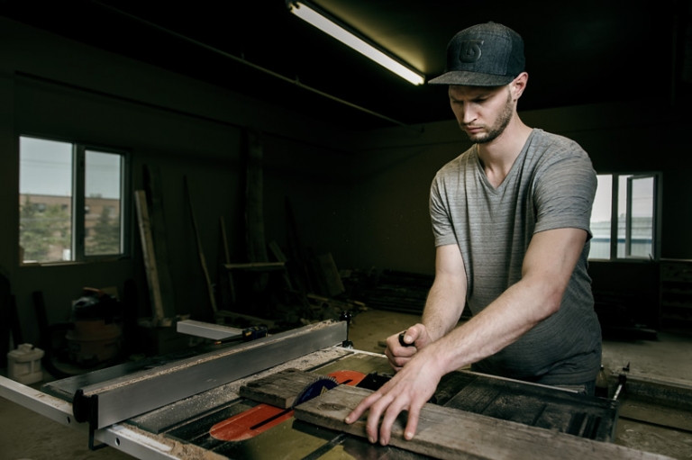 Woodworker cutting wood