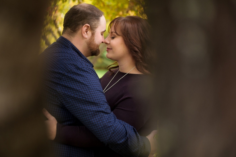 Couple kissing under tree