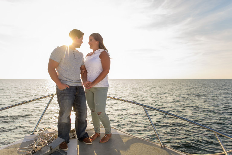Couple's engagement session on a boat in Cap-Pele