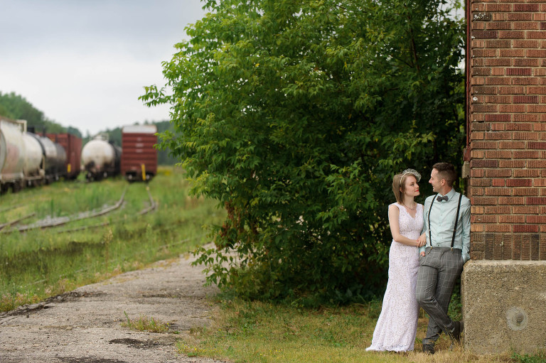 Bride and groom with train tracks
