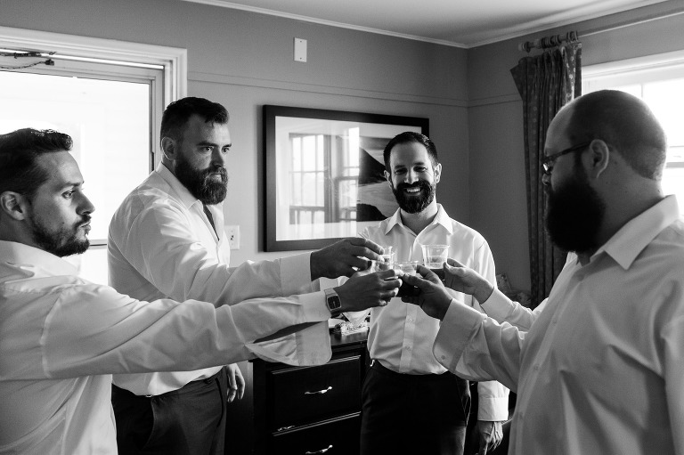 Guys giving toast on wedding day
