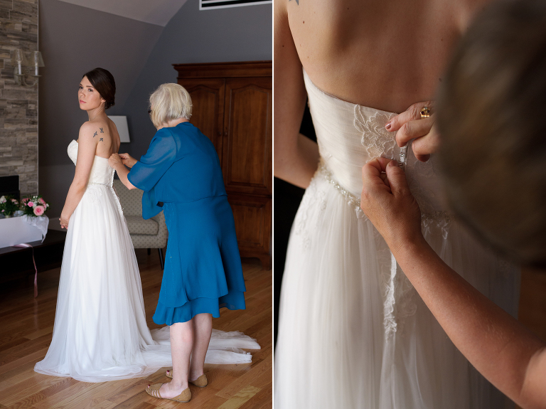 Mother helping bride with wedding dress