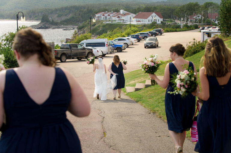 Bride walking to wedding ceremony at Keltic Lodge