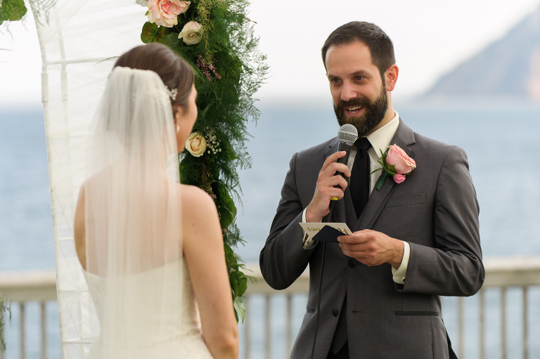 Groom reading personalized vows