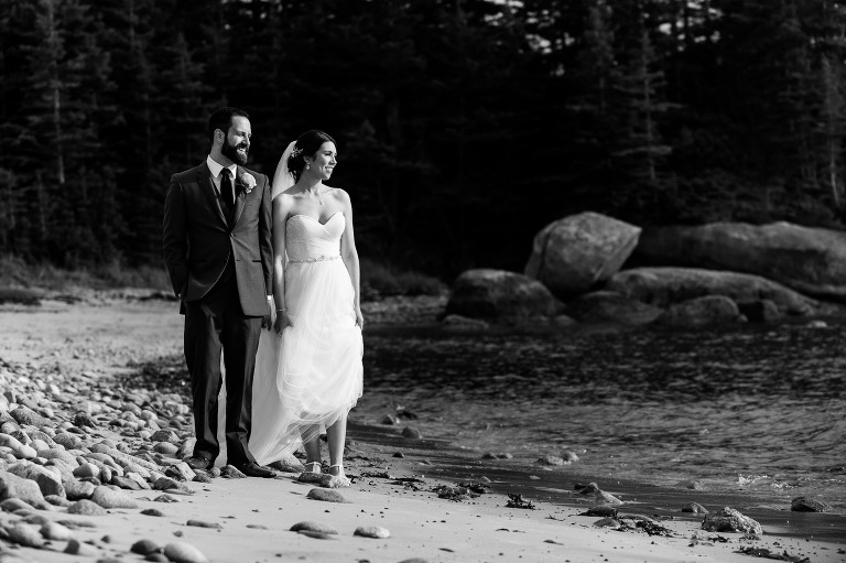 Bride and groom walking on Ingonish Beach