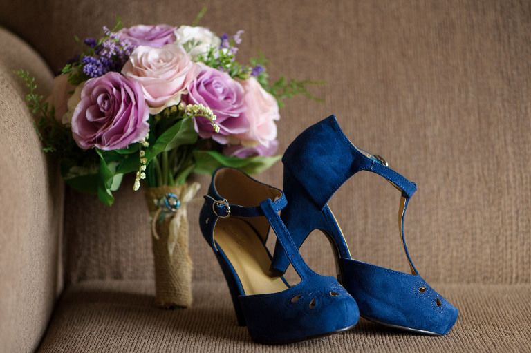 Purple wedding flowers and blue shoes