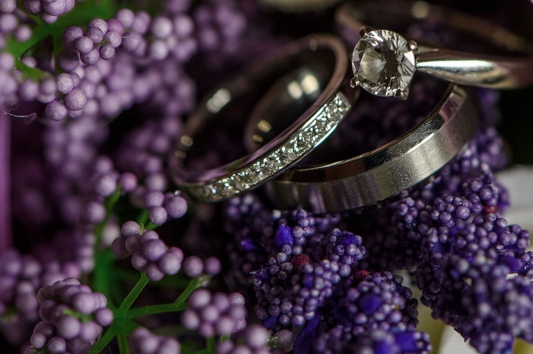 wedding rings on purple flowers