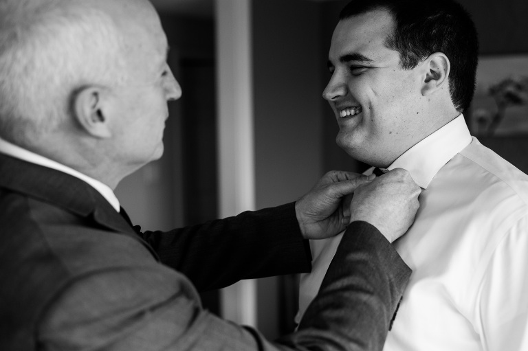 Father of the groom helping son