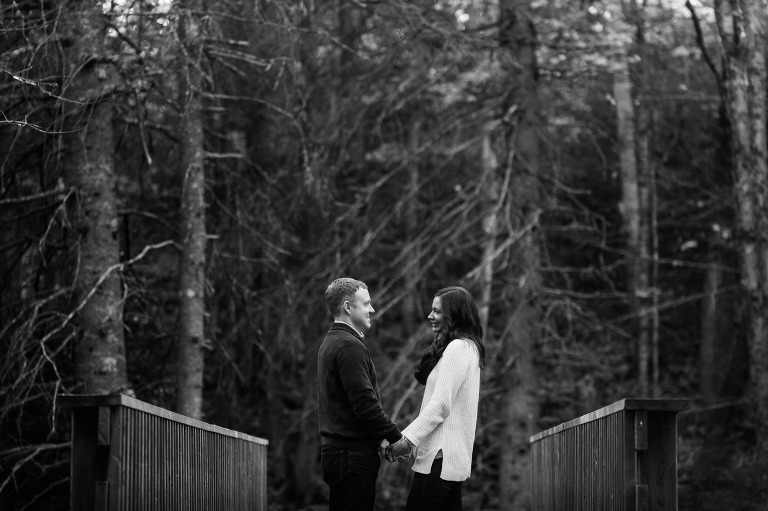 Couple on bridge in woods