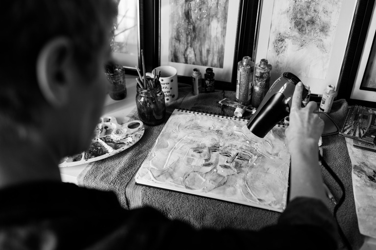 Artist working on a painting
