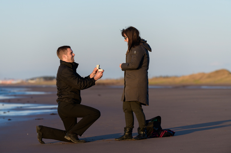 Proposal on the beach at sunset