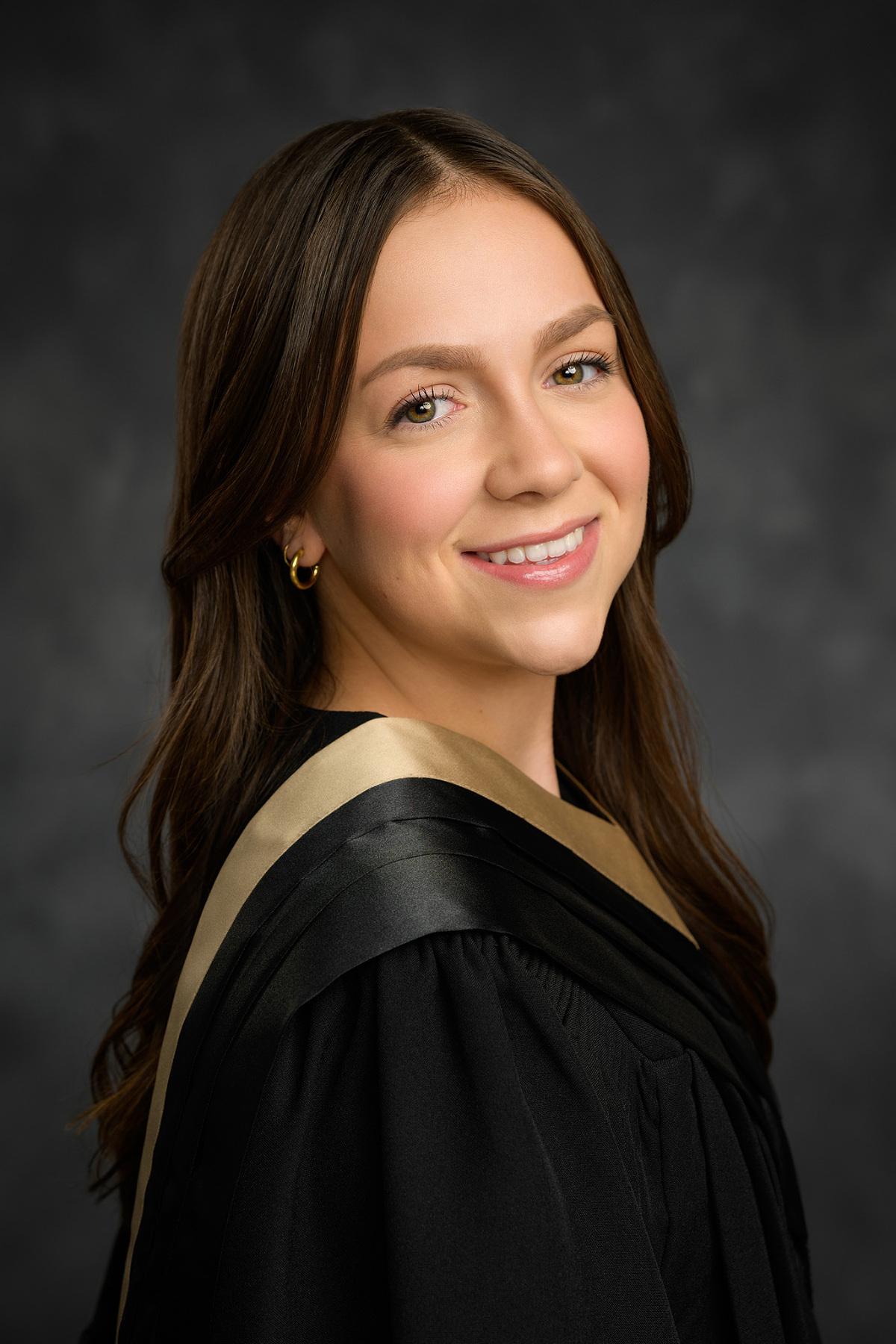 Traditional graduation portrait of female university student